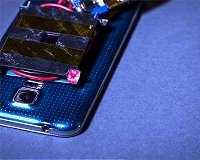 Using a laser to wirelessly charge a smartphone safely across a room