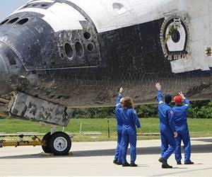 Commander, NASA savor moment as Atlantis lands
