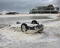 Flash flooding, wild winds whip Australia's northeast