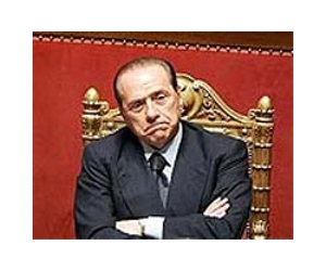 Berlusconi survives no-confidence votes