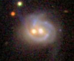 Nearby Galaxy Boasts Two Monster Black Holes, Both Active
