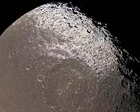 Saturn's Third Moon Begins To Yield Its Secrets