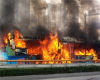 China bus arson suspect threatened violence: media