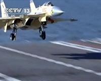China flies J-15 fighters from lone carrier in demonstration