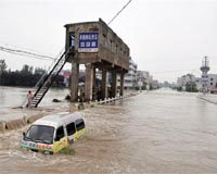 Nine dead, 91,000 flee homes in east China floods: state media