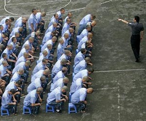 China formally abolishes labour camps: state media