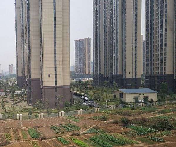 China offers to buy up commercial housing to boost property market