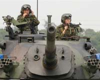 Taiwan to scrap conscription as China ties improve