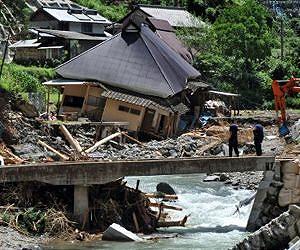Typhoon dumps rain on flood-weary Japan