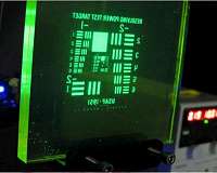 Photoluminescent display absorbs, converts light into energy