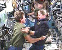 Discovery Docks With Space Station; Spacewalk Set For Friday