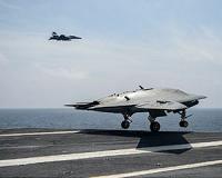 Drones fly alongside manned planes in Navy test mission