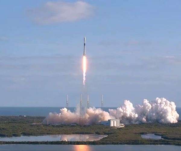 SpaceX sets rocket booster reuse record in satellite launch