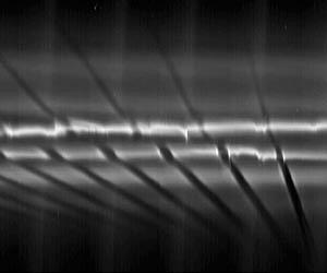 Cassini Sees Moon Building Giant Snowballs In Saturn Ring