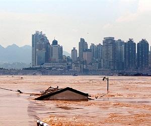 China warns of more rain after deadly floods