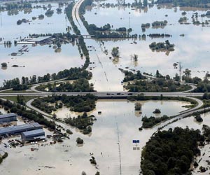 Merkel urges greater flood protection as tours region