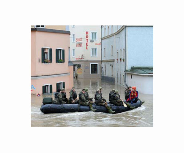 Merkel visits 'surreal' flood zone as death toll rises