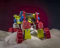 Planetary exploration rover avoids sand traps with 'rear rotator pedaling'