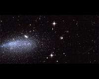 One galaxy, two asteroids