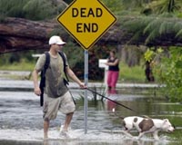 Lingering Fay dumps rain on south, eyes New Orleans
