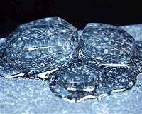 How does water melt? Layer by layer