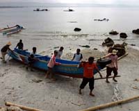 Five killed, islands isolated in Indonesian storm: official