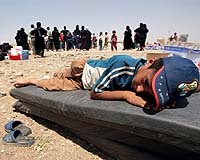 Caught between government and militants, Iraqis despair
