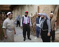 Iraqis turn to sketches and songs to contain virus
