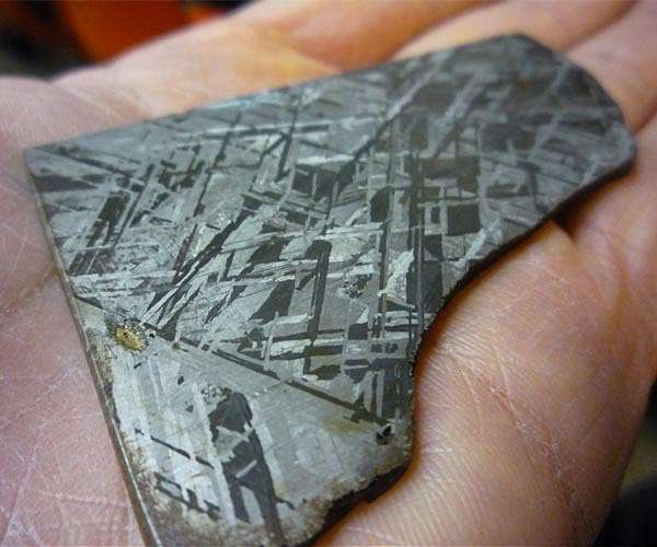 A role for meteoritic iron in the emergence of life on Earth