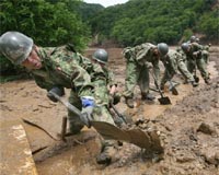 Japan troops hunt for survivors as quake toll hits nine
