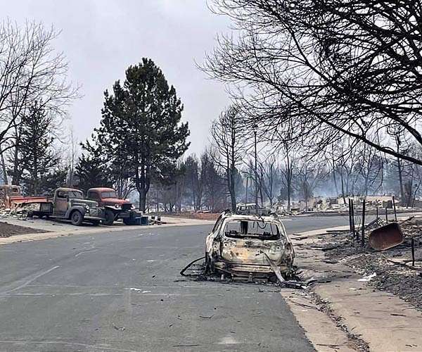 One found, two feared dead as towns smolder from Colorado wildfire