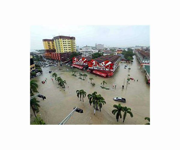 At least four dead, tens of thousands evacuated in Malaysia floods