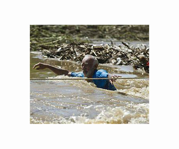 Three dead, 15 missing after Guatemalan river sweeps away homes