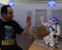 Touching a robot can elicit physiological arousal in humans