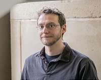 Updated computer code improves prediction of particle motion in plasma experiments