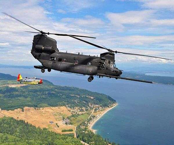 C-5 Galaxy cargo plane carries Chinook helicopters from U.S. to Australia