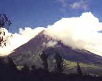 Hundreds flee rumbling Philippines volcano, typhoon