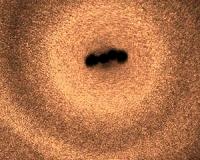Moving microswimmers with tiny swirling flows