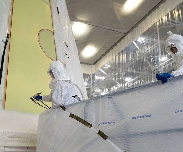 Technicians apply foam to Artemis III