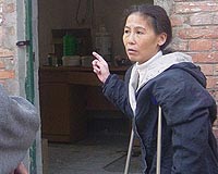 China rights activist jailed for two years: husband