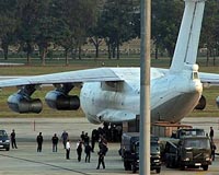 Thailand holds weapons plane crew for 12 more days