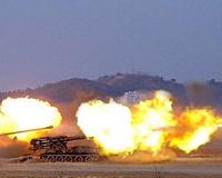 North Korea fires 100 artillery shells into sea