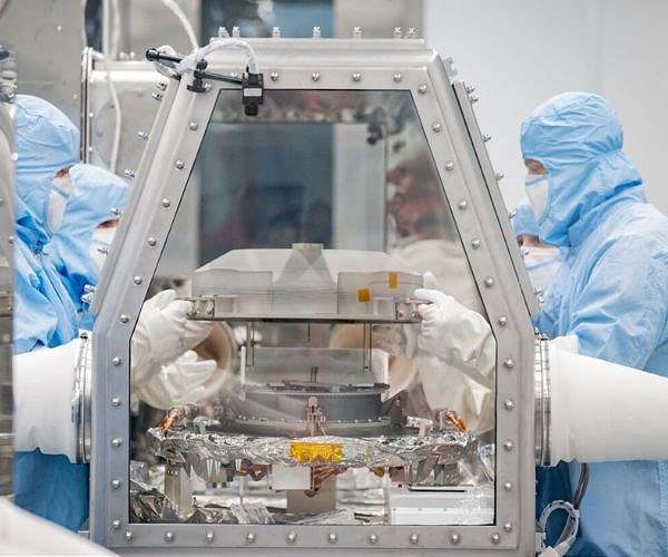 The OSIRIS-REx sample canister lid is removed