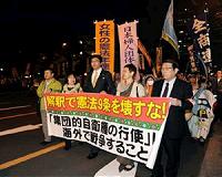 Pacifists rally as poll shows Japan uneasy over military