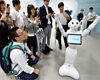 Chatty Japan robot makes friends on first day at work