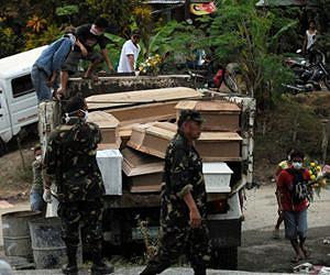 13 dead, millions without power as typhoon hits Philippines
