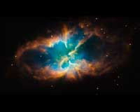 Hubble Snaps Images Of A Nebula Within A Cluster