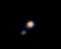 Pluto probably a binary planet with largest moon Charon