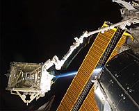 Discovery astronauts begin space walk