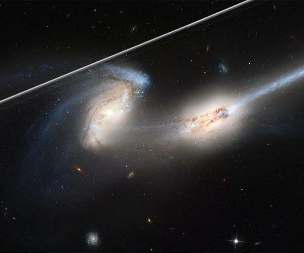 Scrubbing Hubble images of satellite light tracks